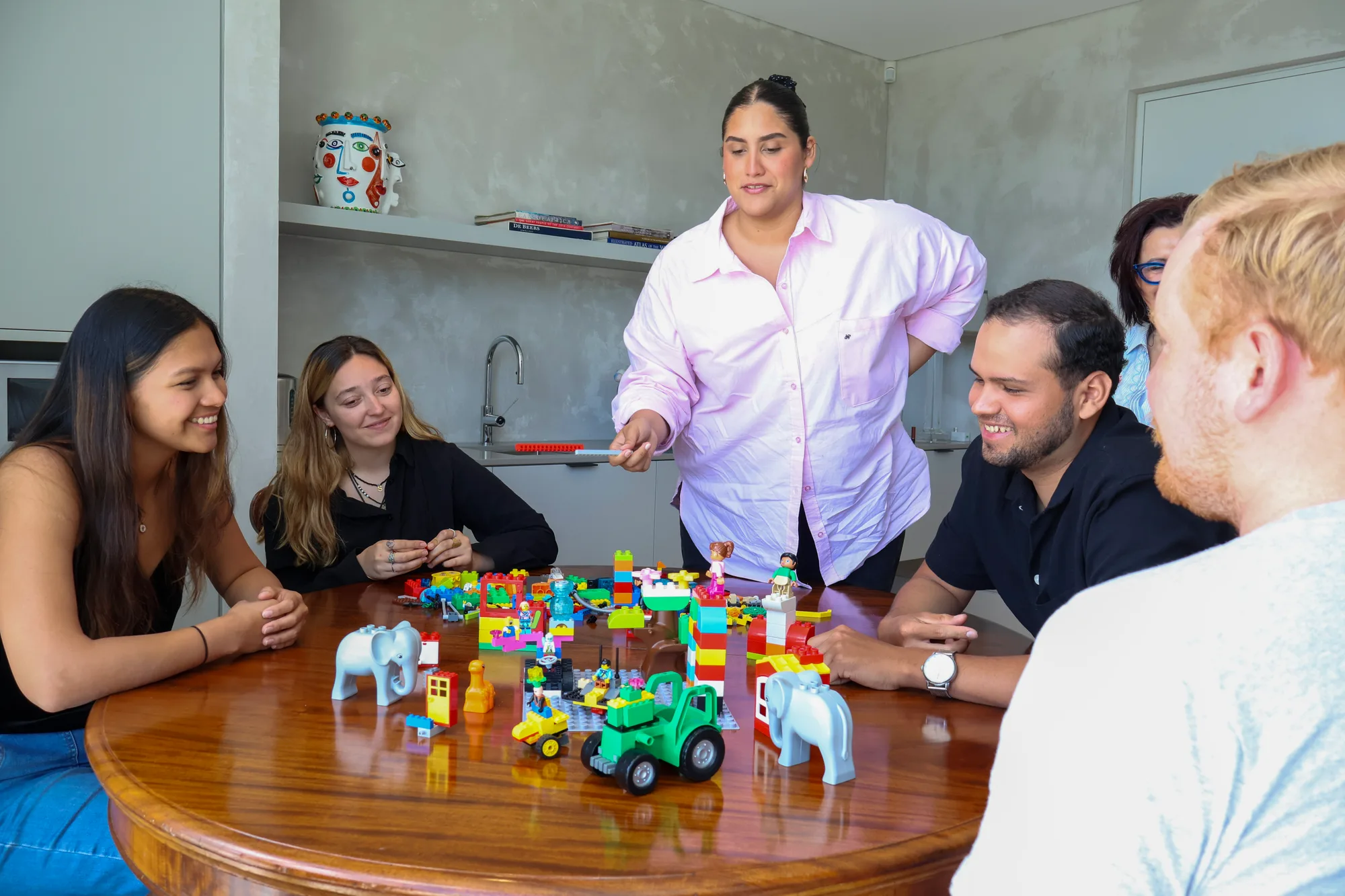 A LEGO model contrasting a fun but superficial workshop with a structured, impactful one.