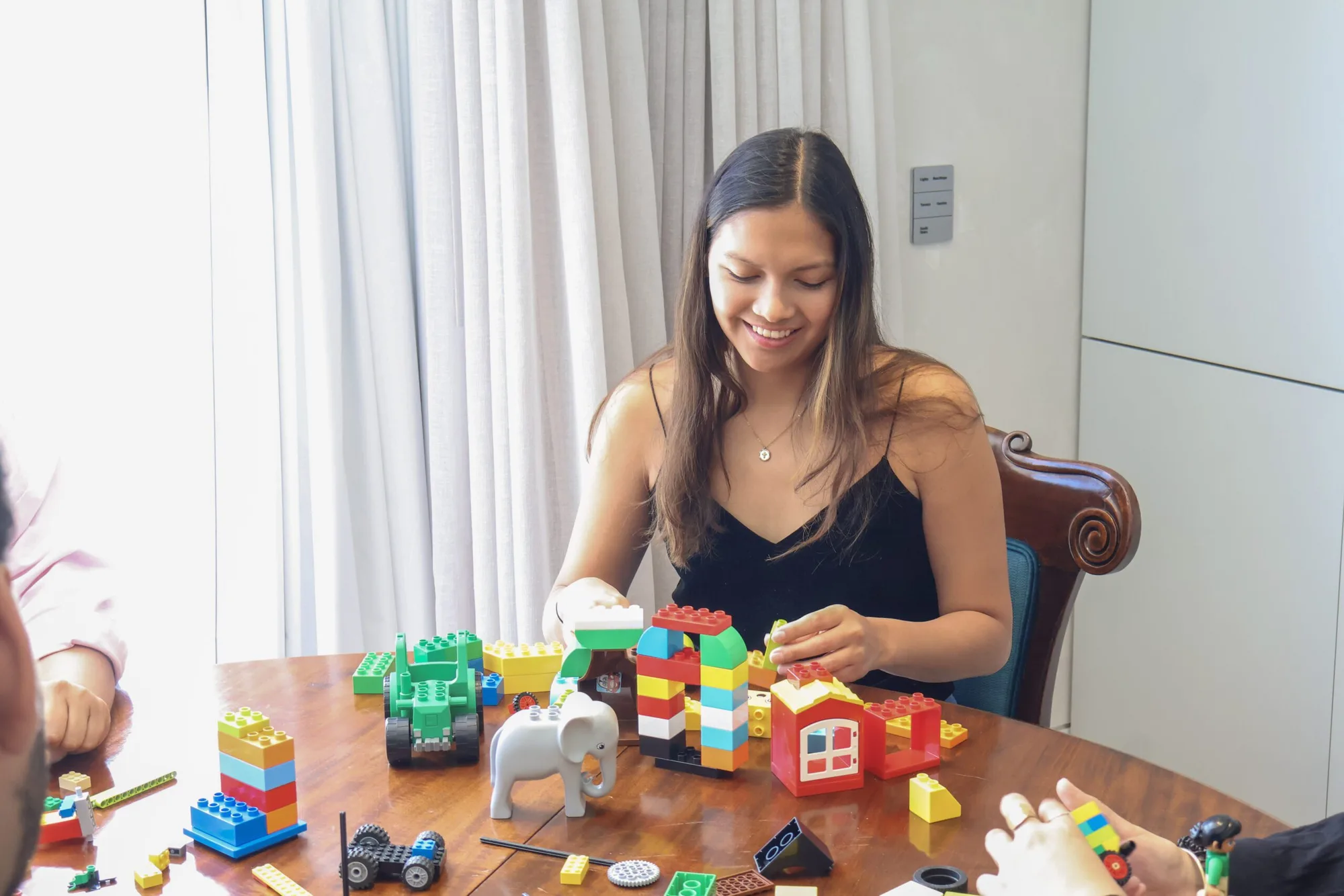 A facilitator guiding a team through a structured LEGO Serious Play session.