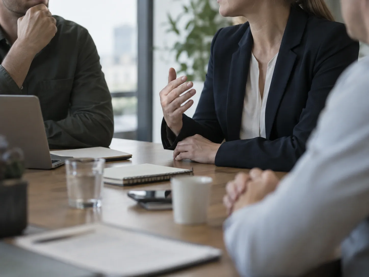 A team meeting where one person speaks and the rest of the group sits without contributing