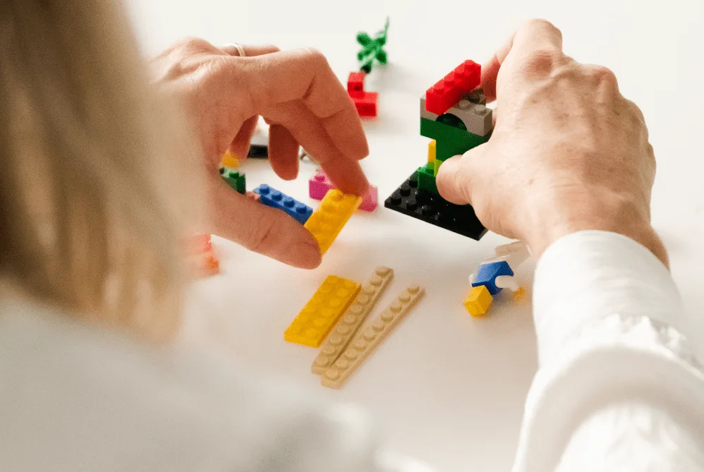 A team collaborating on a strategic plan using LEGO Serious Play.