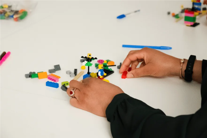 A team resetting during a LEGO Serious Play workshop