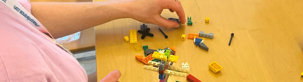 A complex LEGO model representing team alignment and strategic planning.