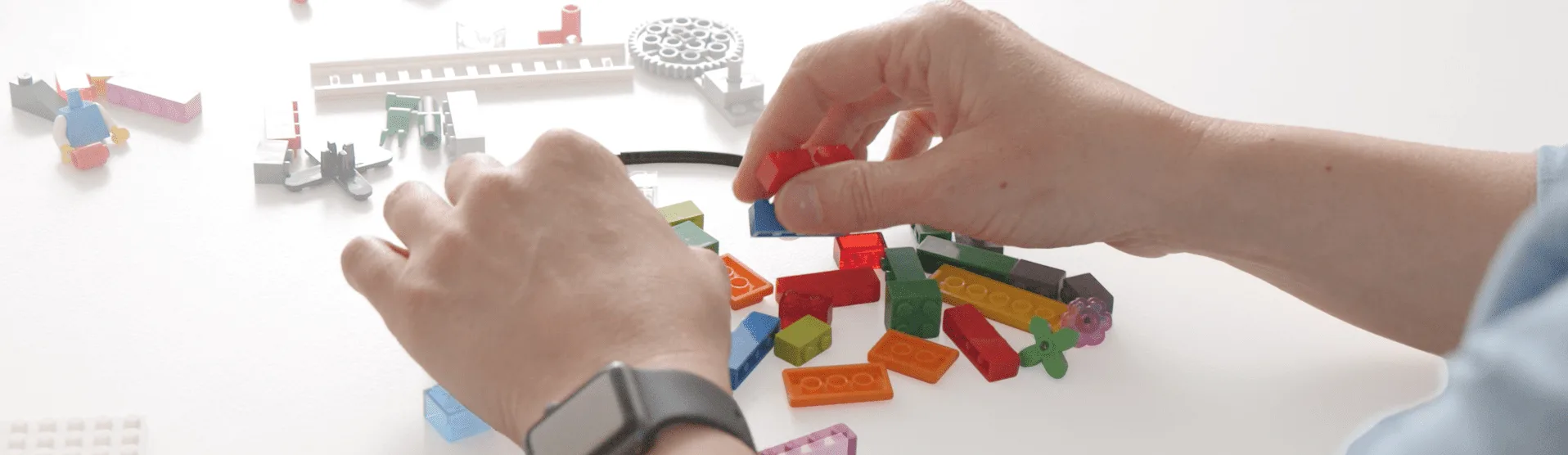 A collage of different professionals using LEGO Serious Play in their work.