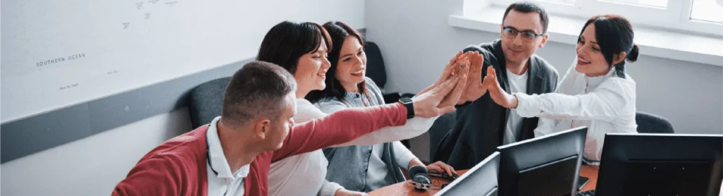 A team engaged in a LEGO® Serious Play® Method session, using LEGO® bricks to build models that foster teamwork, problem-solving, and conflict resolution.