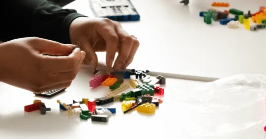 A collection of colorful LEGO models representing different ideas from a team.