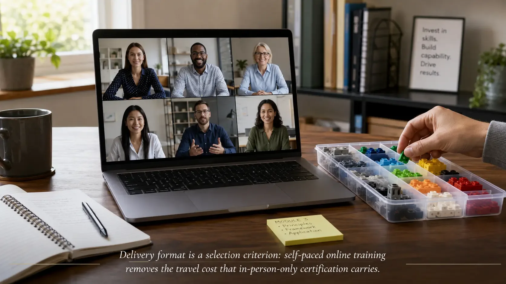 Facilitator completing online LEGO® SERIOUS PLAY® certification training with bricks beside a laptop.