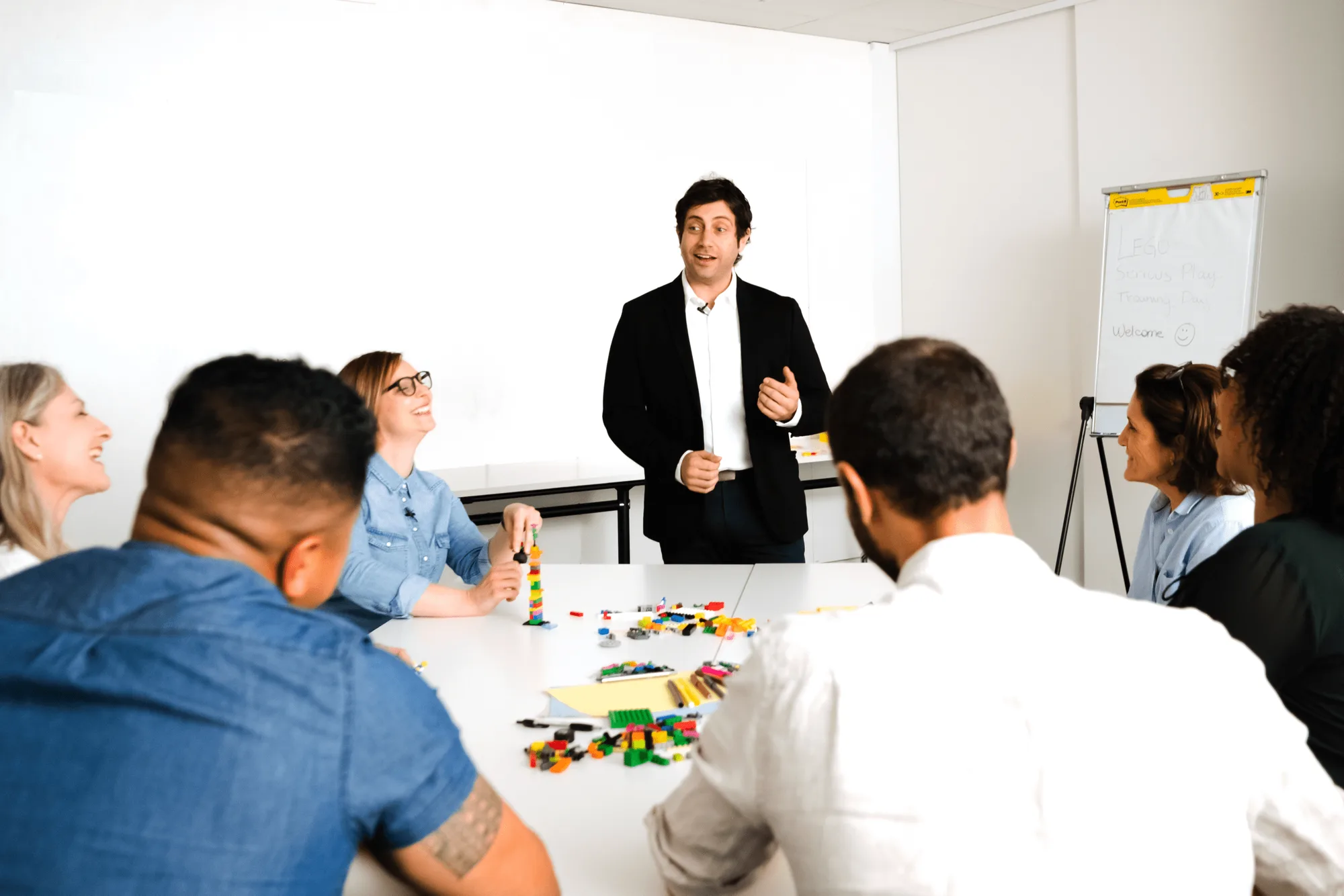 A facilitator leading a LEGO Serious Play workshop
